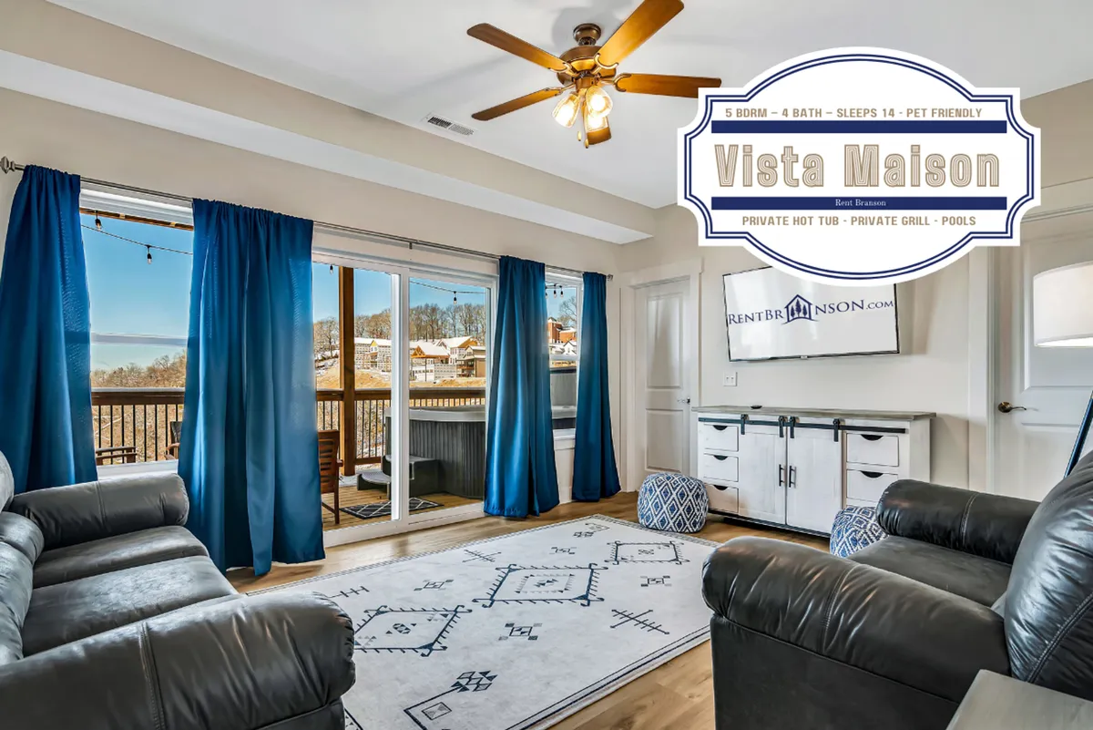 A comfortable living room featuring plush leather sofas, a decorative area rug, large sliding glass doors with blue curtains, and views out to the balcony or deck. The room is staged for relaxation and group activities such as movie nights or board games, with natural light pouring in.